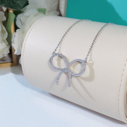 [Haelin Jewelry]CLAW SET RHODIUM PLATED BOW NECKLACE